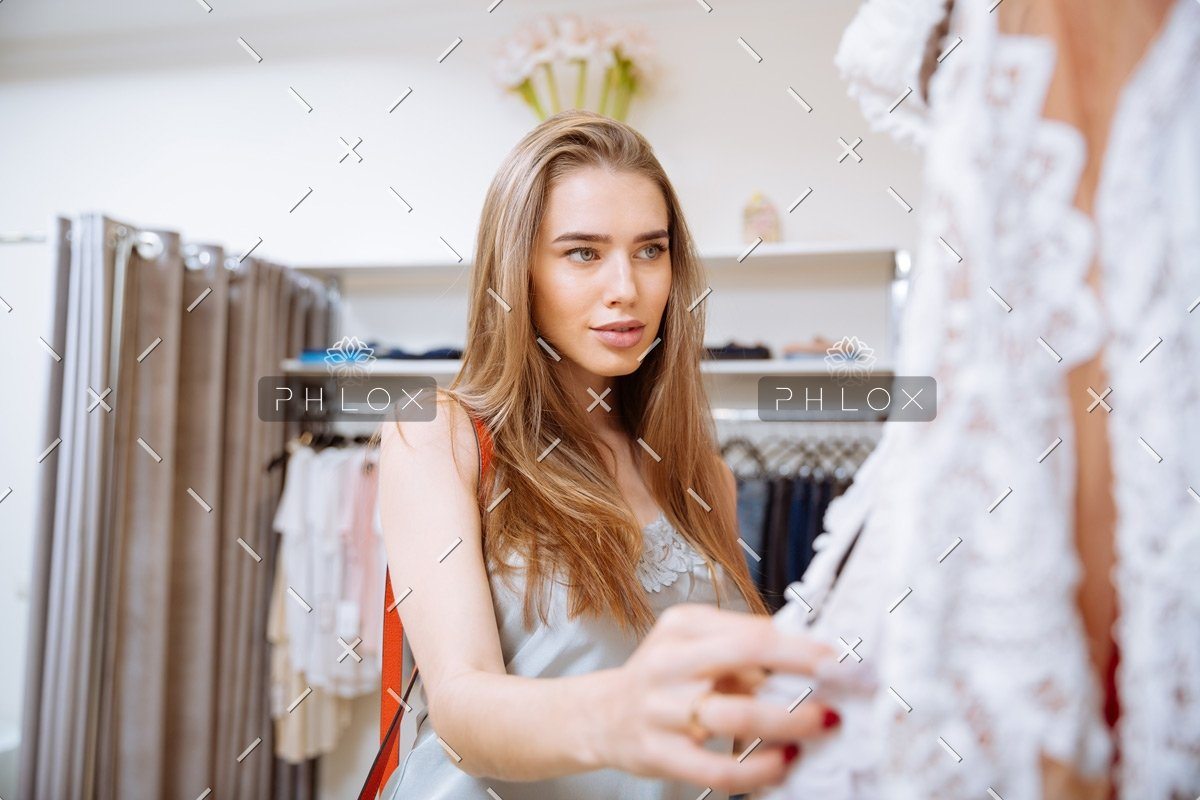 woman doing shopping and choosing clothes in PDEP6XU